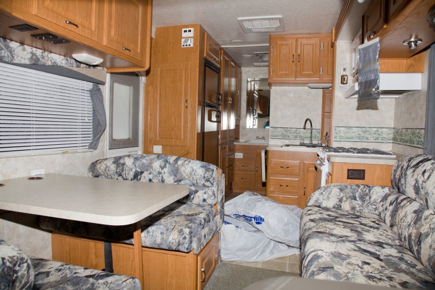 Looking back from the drivers cabin, this is our living room and kitchen (excuse the spare tires)!!